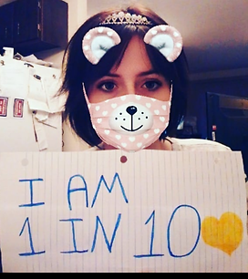 Pic of me holding sign that says I am 1 in 10