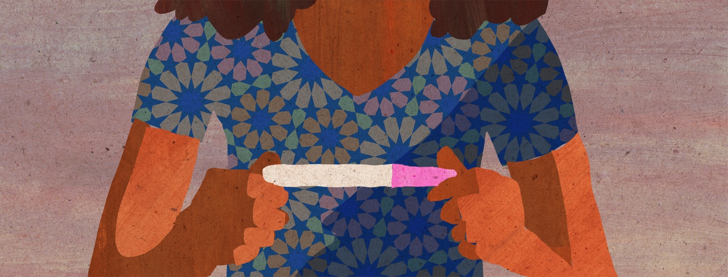 Woman holding a pregnancy test