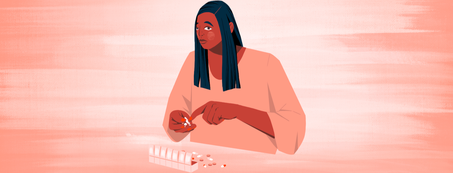 A woman holding pills