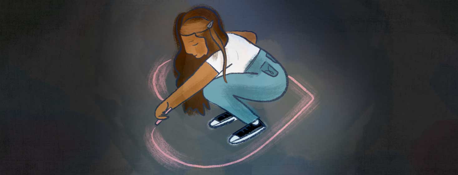 a woman drawing a heart in chalk around her on the floor